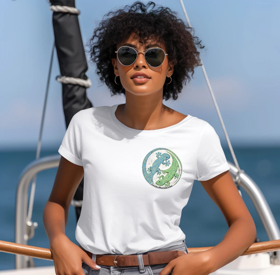 Woman wearing a white t-shirt with a green and blue logo on a boat